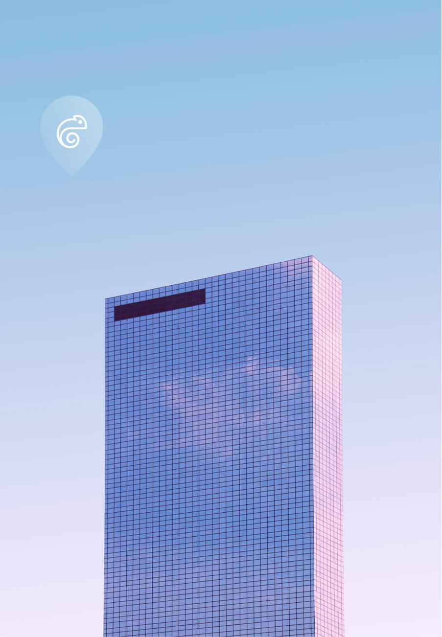 Imagem de um prédio com vidros espelhando o céu